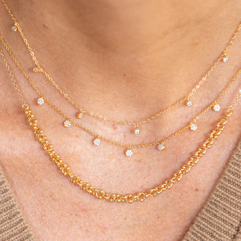 Collier plaque or ron